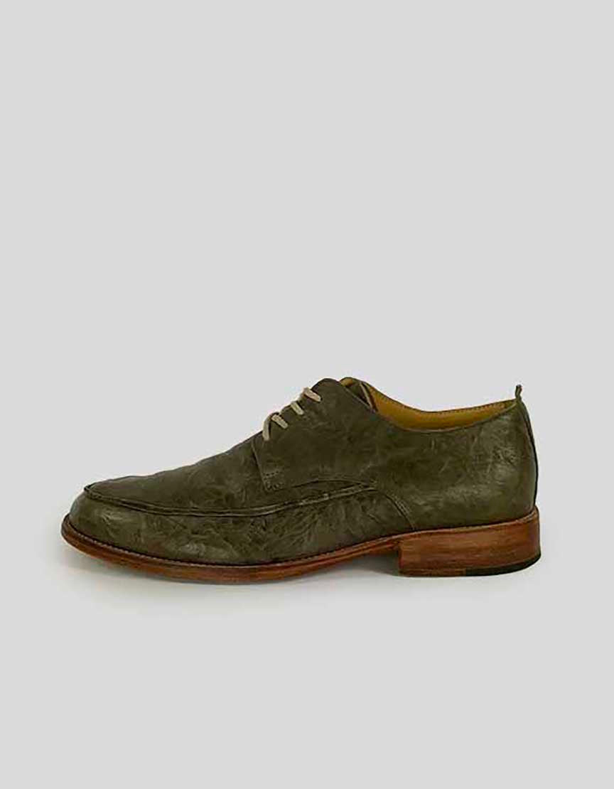 A single ESQUIVEL men's leather lace-up shoe with a greenish upper, brown leather lining, and stacked wooden heel on a white background.