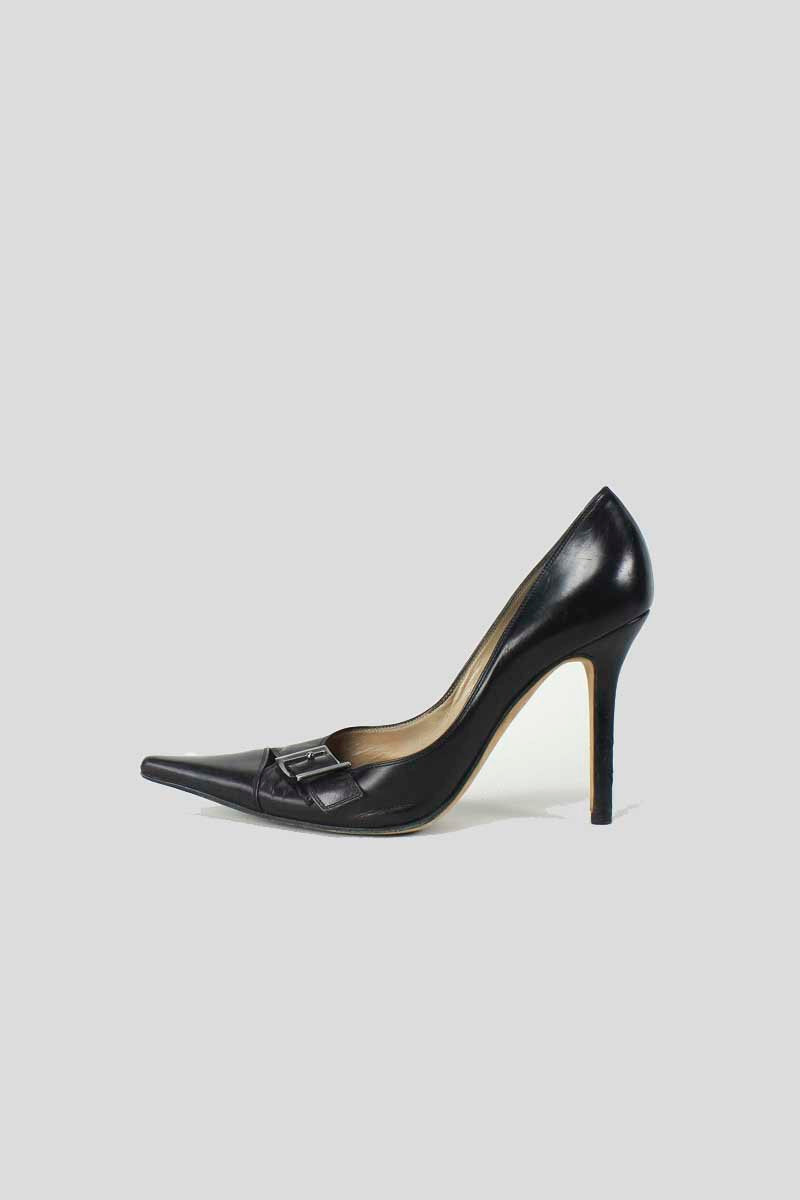A pair of black leather pumps with silver-tone buckle accents and leather-covered heels.