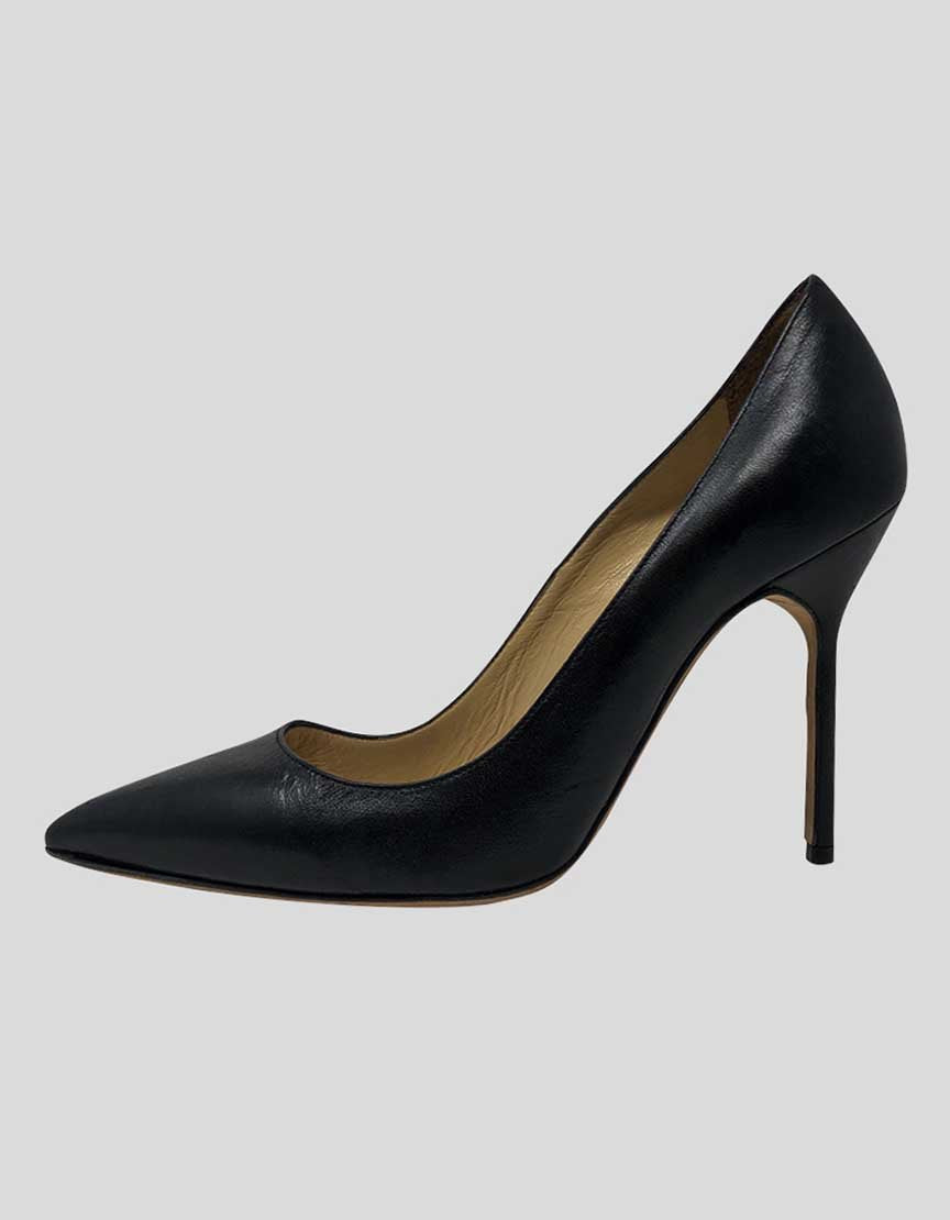 Black leather pointed-toe pump with a high heel and tonal stitching.