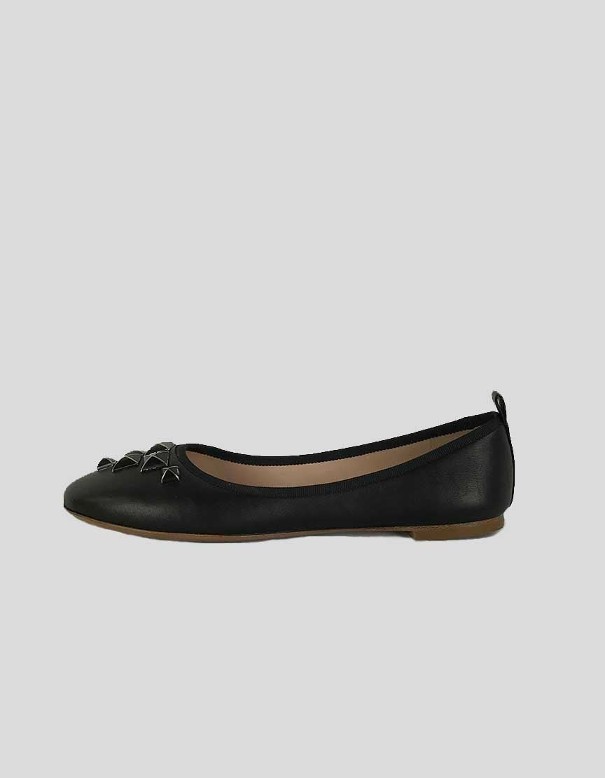 A pair of MARC JACOBS black leather flats with silver-tone stud design at front and grosgrain trim.