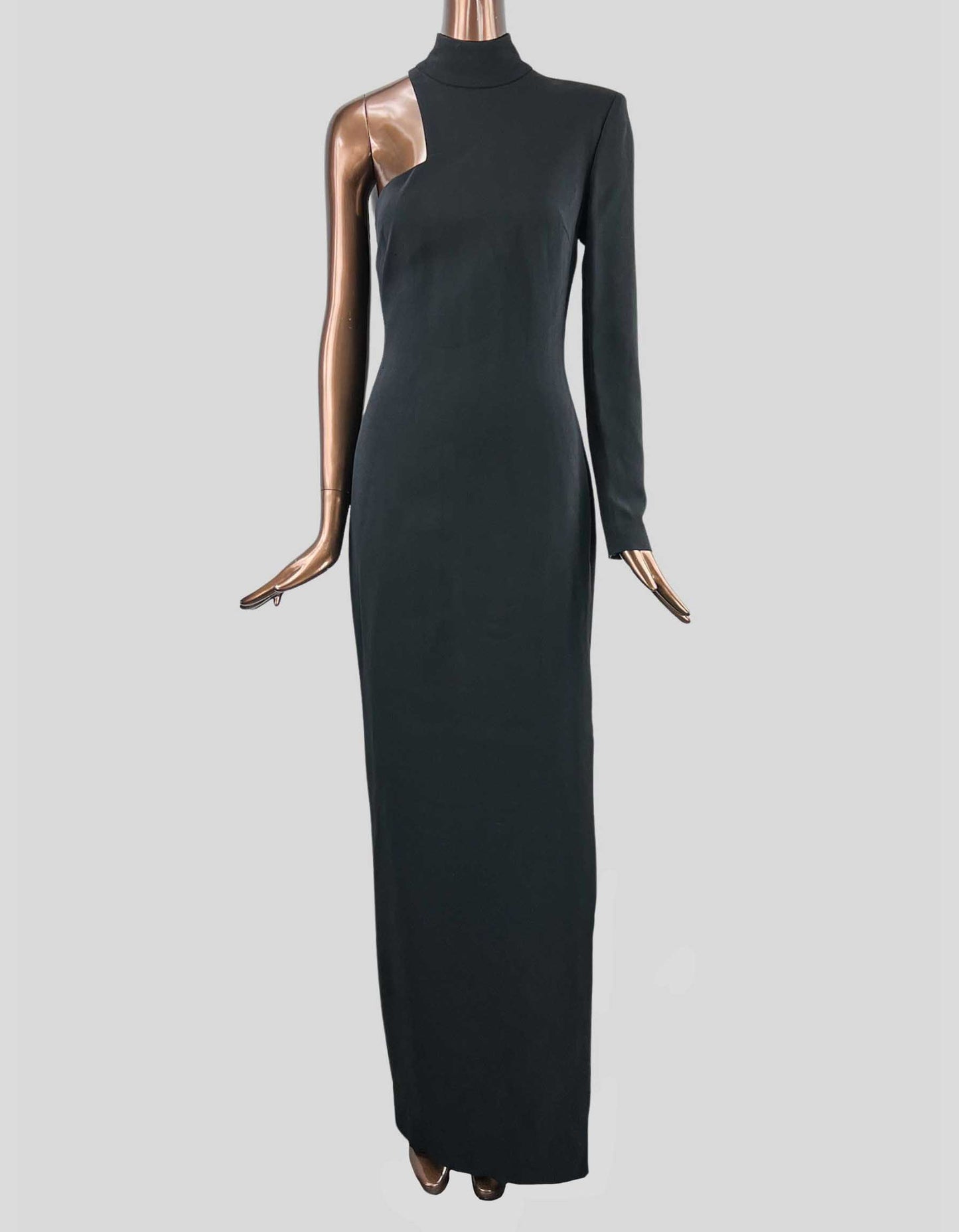 A black TOM FORD one-shoulder gown with a high neck, side slit, and a single long sleeve featuring a zip closer at wrist, displayed on a mannequin.