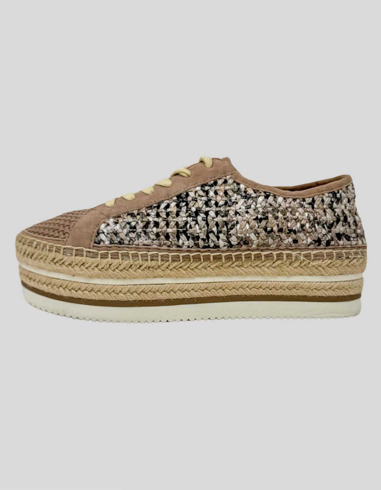 A pair of VINCE CAMUTO platform sneakers with open weave panels in a brown color, featuring a lace-up closure and a rubber outsole.