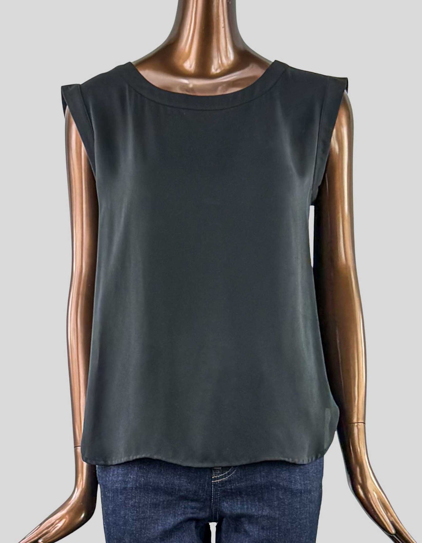 J. CREW sleeveless top is a softly structured drape. Round neck. Paneling details along the sleeves. Curved at hem for wear tucked or untucked.