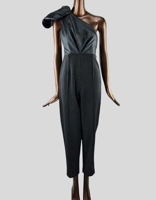 SOLACE LONDON Jumpsuit in black. One shoulder jumpsuit with cropped trousers and a sculptural pleated bodice.