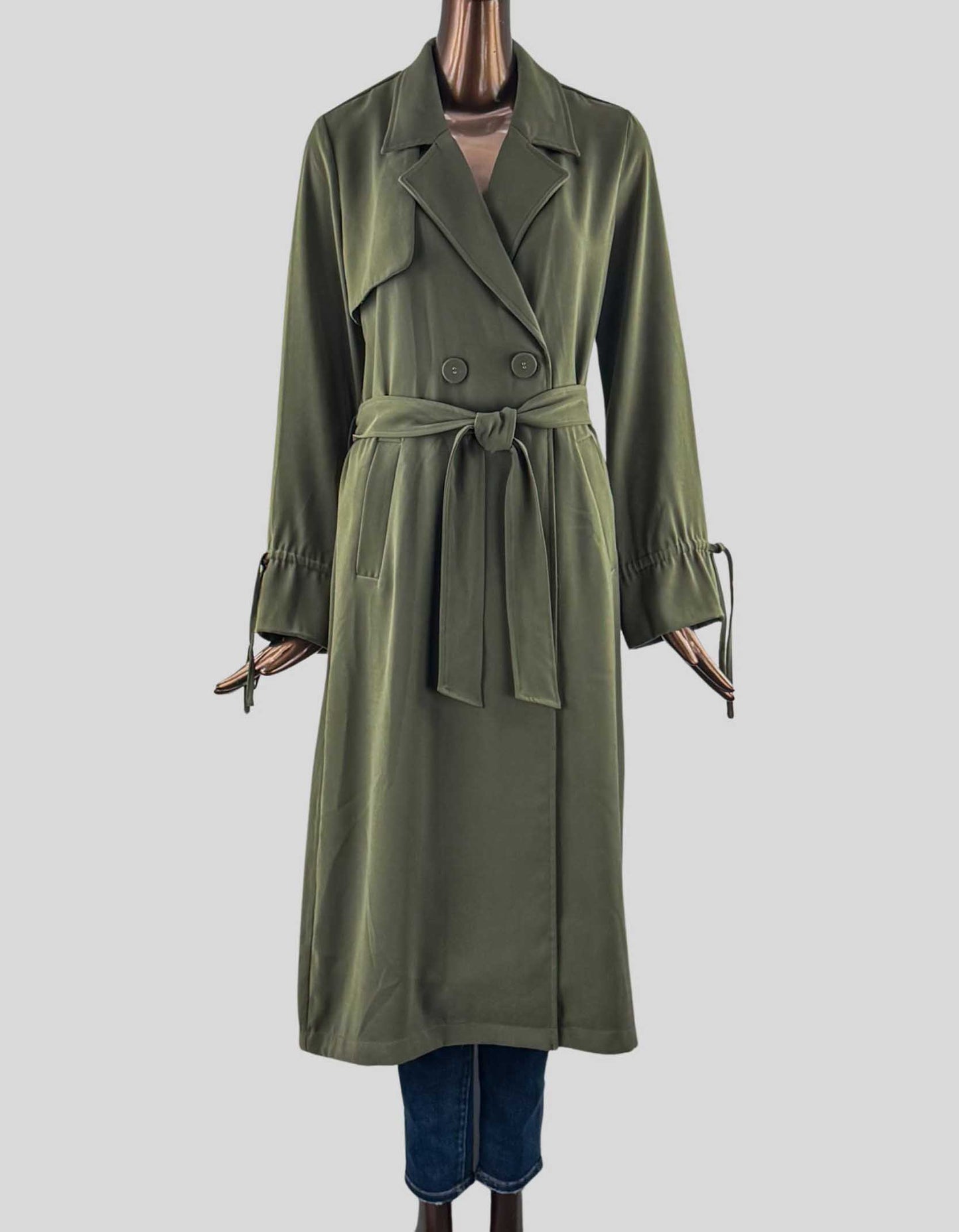 ICŌNE PAR SIMONS VISION Belted Trench Coat. Includes original belt that ties at the waist. Double-breasted, satiny lining, slit pockets, storm flap behind.