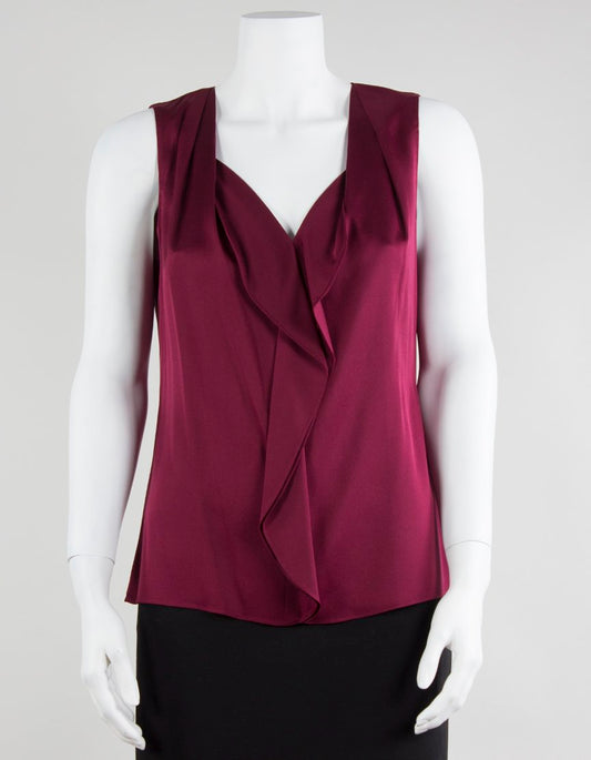 Elie Tahari sleeveless v-neck blouse in burgundy with front ruffles, displayed on a mannequin.