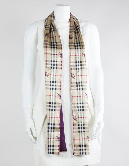 Burberry Scarf With Front Design As The Traditional Plaid With A Purple Burberry Insignia