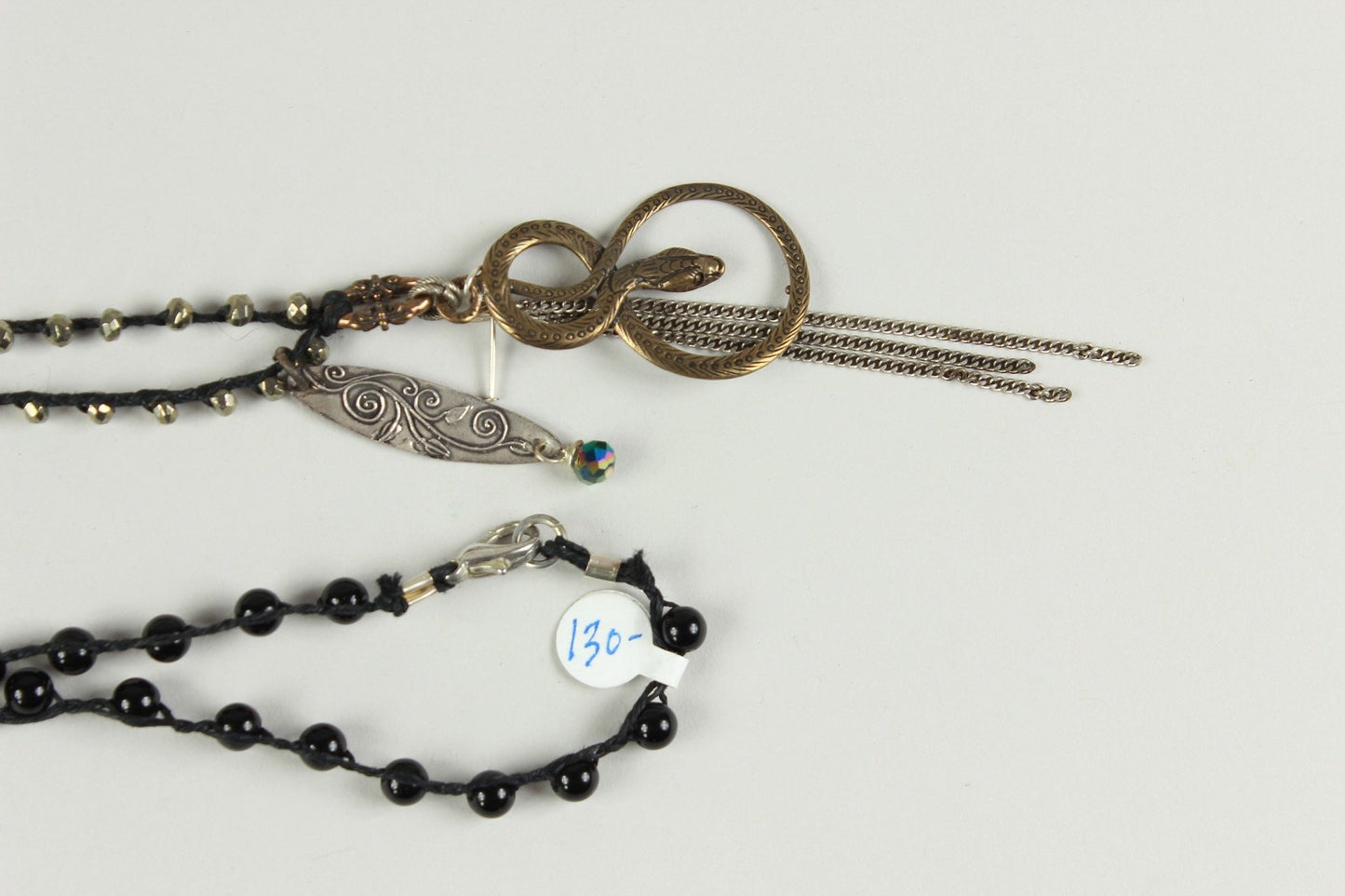 Black Beaded Necklace With Serpent And Leaf Pendent