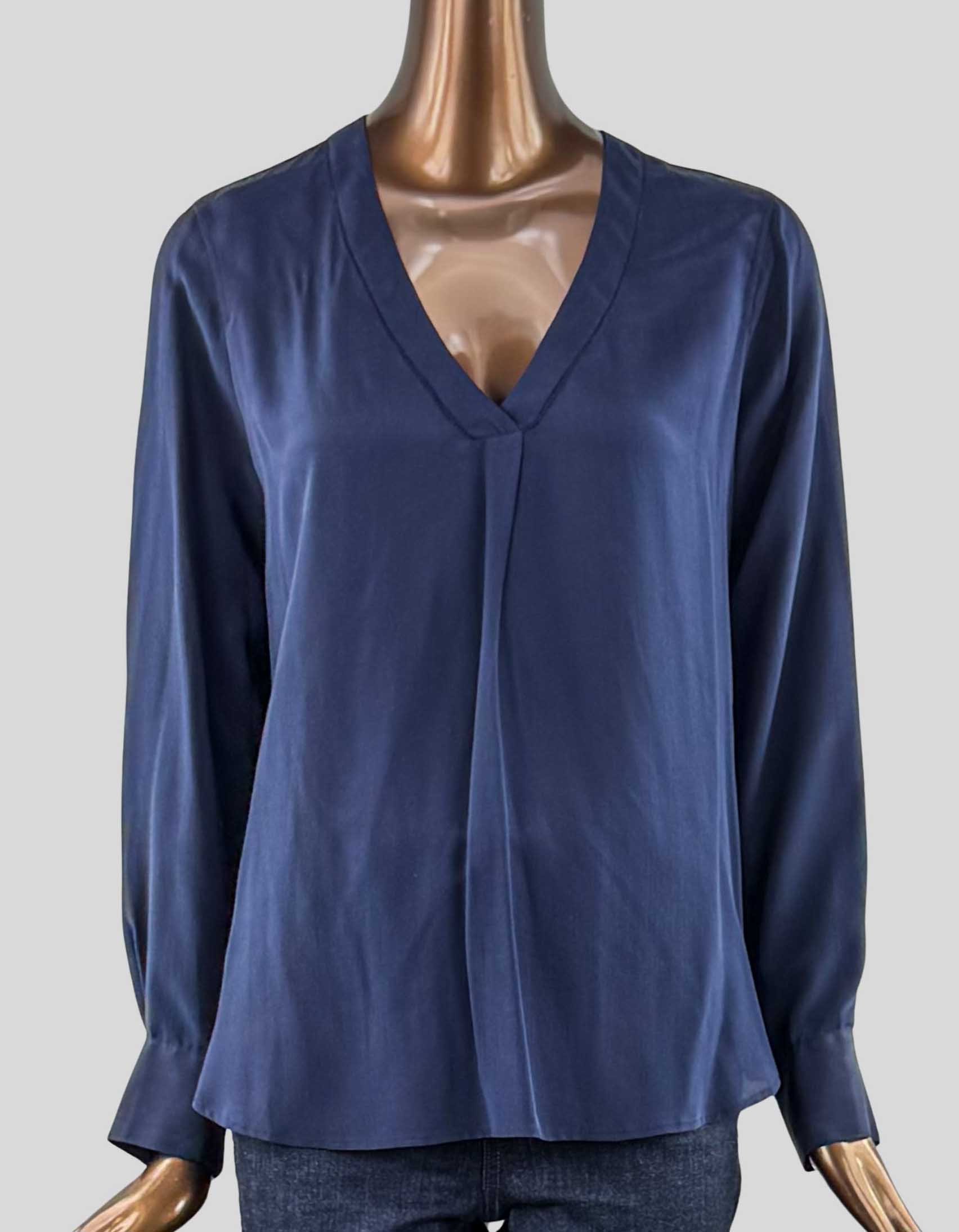  J.CREW classic v-neck silk blouse. Long sleeve with two-button closure cuffs. Single pleat at V-neck. Dotted detail at neckline. 