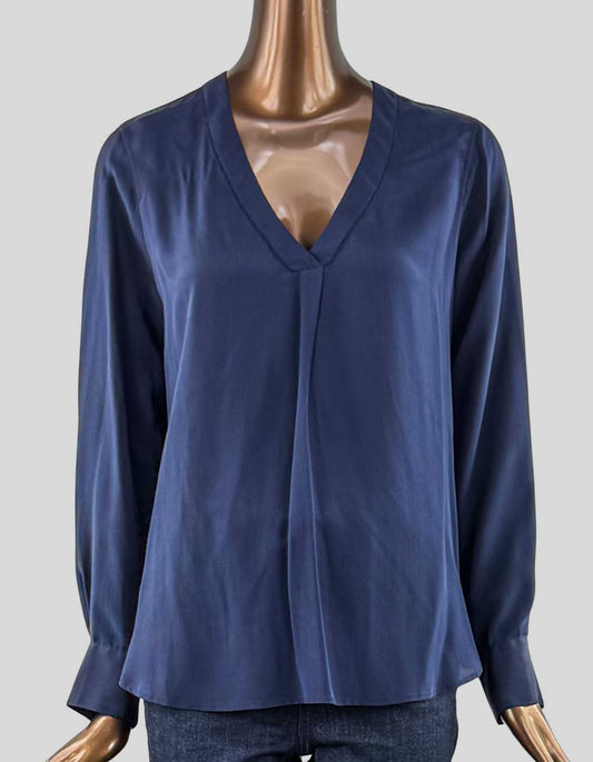  J.CREW classic v-neck silk blouse. Long sleeve with two-button closure cuffs. Single pleat at V-neck. Dotted detail at neckline. 