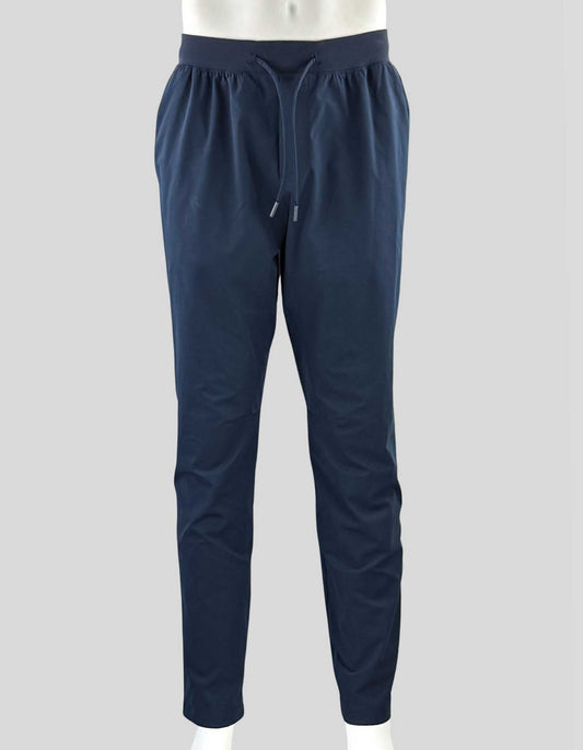  LULULEMON men's Zeroed In Slim-Fit Pant in blue. Slim, tapered fit. Designed for training and casual wear. Elasticated waist with drawstrings. Side pockets and back zip closure pocket. 