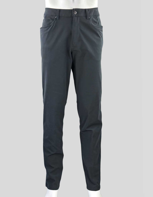 LULULEMON men's Classic-Fit Trouser. Button and zip front closure with belt loops. Back welt pockets with single hidden zip pocket.