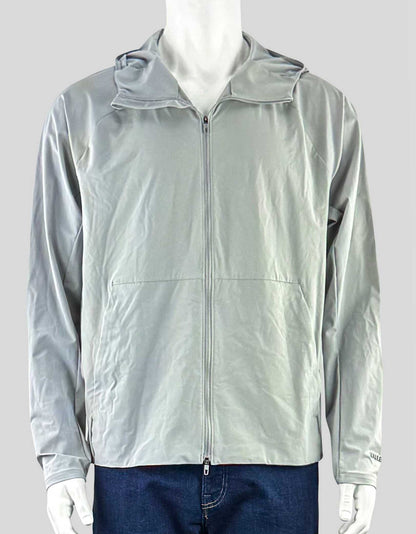 LULULEMON hooded jacket with zip front closure. Zippered pockets with hidden phone sleeve.