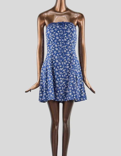  KIMCHI BLUE Addison strapless mini dress. Strapless neckline with lace trim. Tie-up detail at the bust. Button-up front detailing. Tie-corset back. Flared skirt. A-line silhouette. Mini length. Adjustable corset tie. 
