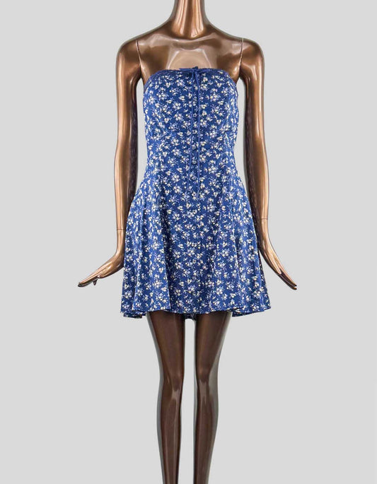  KIMCHI BLUE Addison strapless mini dress. Strapless neckline with lace trim. Tie-up detail at the bust. Button-up front detailing. Tie-corset back. Flared skirt. A-line silhouette. Mini length. Adjustable corset tie. 