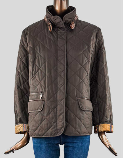 Lauren Jeans Company Brown Barn Jacket. Quilted, patch pocket, stand collar, front pockets, zip and snap front closure, barn jacket with brown leather trim at collar and pockets, and brown horse detail on lining.