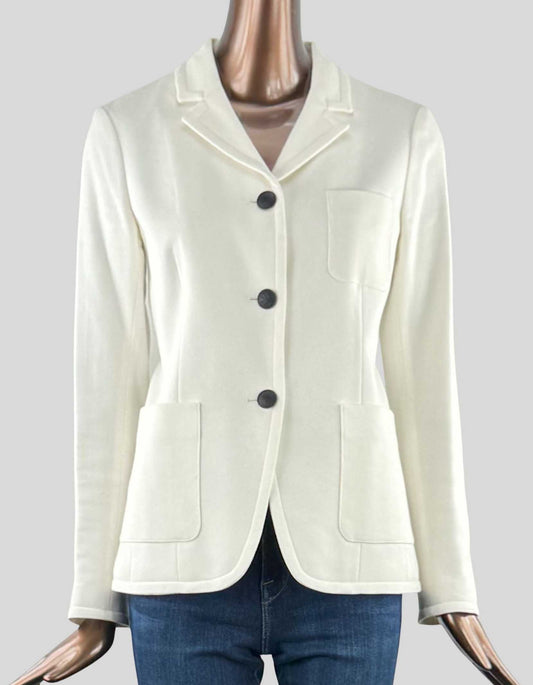  RAG & BONE ivory blazer with three black buttons in front, and one on each cuff. Two hip pockets and one front left breast pocket. Lined. 