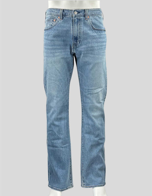 LEVI'S Bootcut 517 Jeans feature a slim fit through the thigh and a flared leg opening, specifically designed to fit over boots. Faded denim color. 