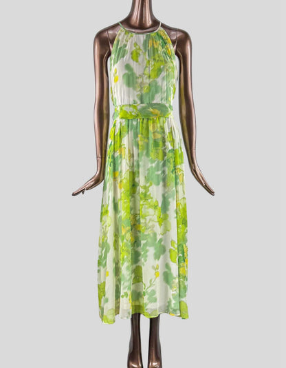 DKNY Halter Neck Midi Dress in green floral. Chiffon fabrication. Floral print. Blouson silhouette. Halter neckline. Sleeveless. Removeable waist tie belt. Lined. Back zipper closure.