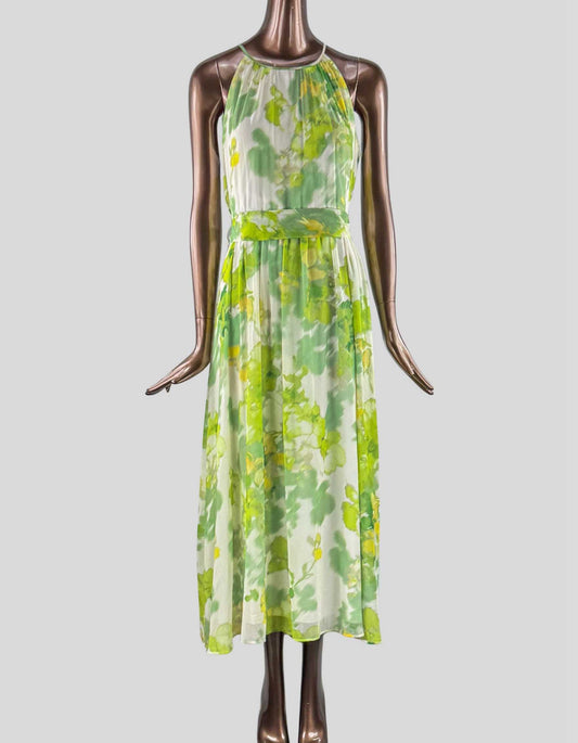DKNY Halter Neck Midi Dress in green floral. Chiffon fabrication. Floral print. Blouson silhouette. Halter neckline. Sleeveless. Removeable waist tie belt. Lined. Back zipper closure.