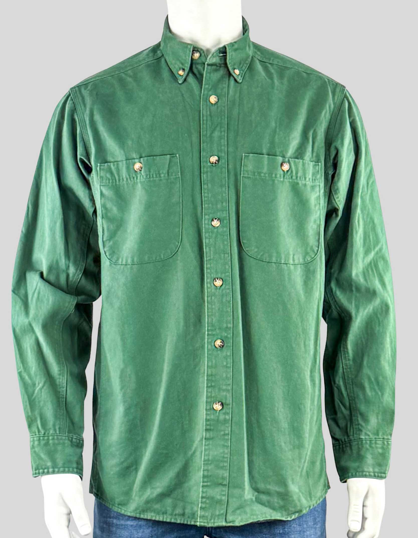 WRANGLER RIGGS WORKWEAR Long Sleeve Button Down Solid Twill Work Shirt. Button front closure, two rounded bottom front pockets with button-through, two button adjustable cuffs, button down collar.