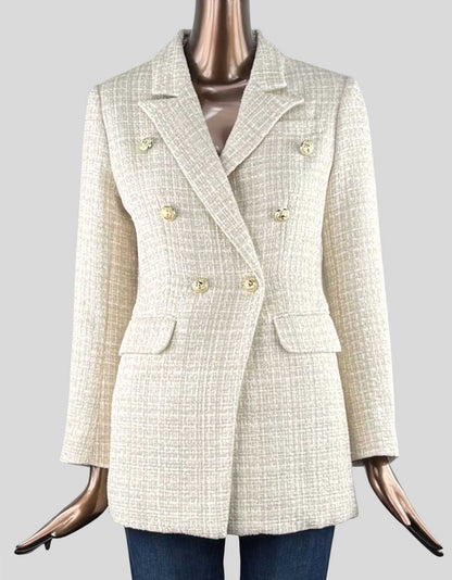 BELLE & BLOOM Princess Polina Tweed Blazer in Beige Marle color with timeless 'captain style' golden buttons. Fitted cut. Notch lapel collar. Single-breasted closure. Decorative golden buttons. Side pockets with flap.