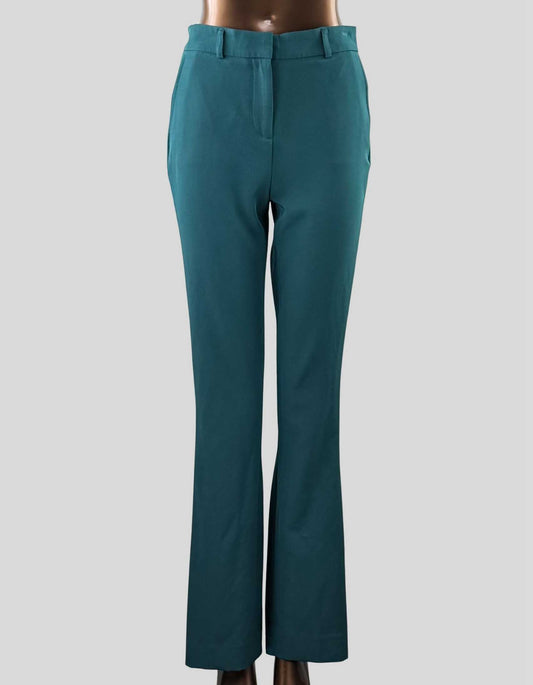 WHITE HOUSE BLACK MARKET High-Rise Piper Flare Pants in green. Stretch Waistband. Zipper with hook + bar closure. Slant pockets + back welt pockets. Belt loops.
