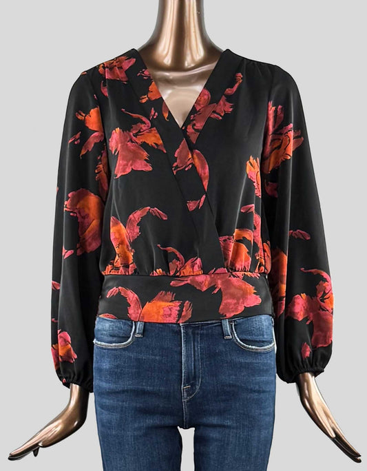 NINE WEST crossover blouse in black with orange and red flowers. Long sleeve with elasticated wrists. Elasticated waistband in back. 