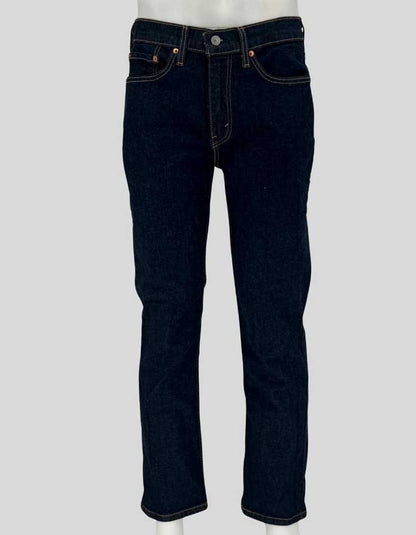 Authentic screen-worn Levi's 514 straight leg dark indigo denim jeans featuring classic five-pocket styling, signature red tab, and copper rivets. 
