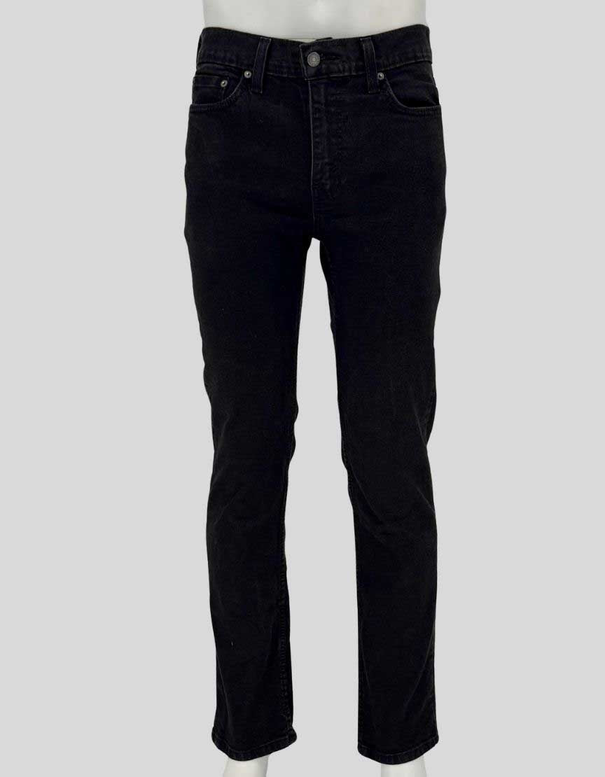 Authentic screen-worn Levi's 514 straight leg black denim jeans featuring classic five-pocket styling, signature red tab, and copper rivets.