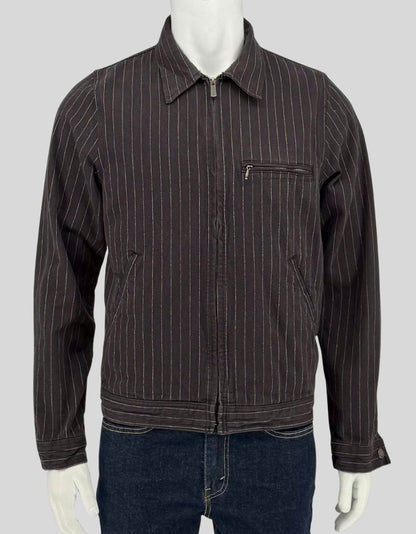 Authentic screen-worn Dickies black cotton twill work jacket featuring white pinstripe pattern, full zip closure, chest pocket, and slash pockets.