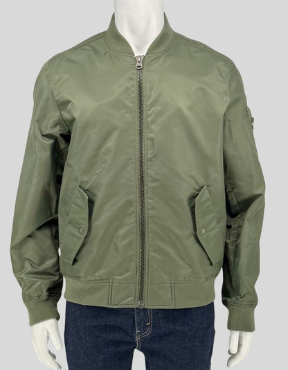 Authentic screen-worn Levi's olive nylon bomber jacket featuring silver zipper closure, side pockets, sleeve utility pocket with zipper, and ribbed cuffs and hem.