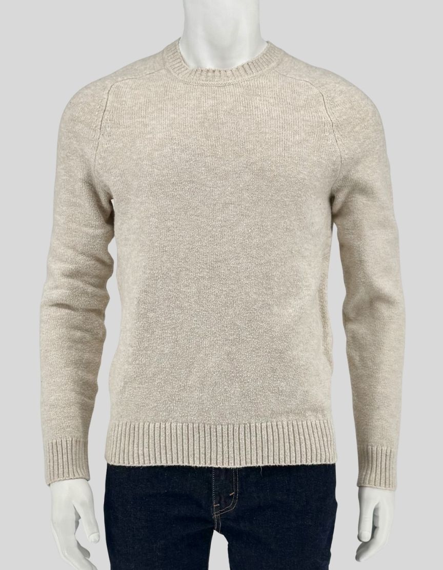 Authentic screen-worn Banana Republic cream heather knit sweater featuring ribbed neckline, cuffs and hem, with raglan sleeve construction.