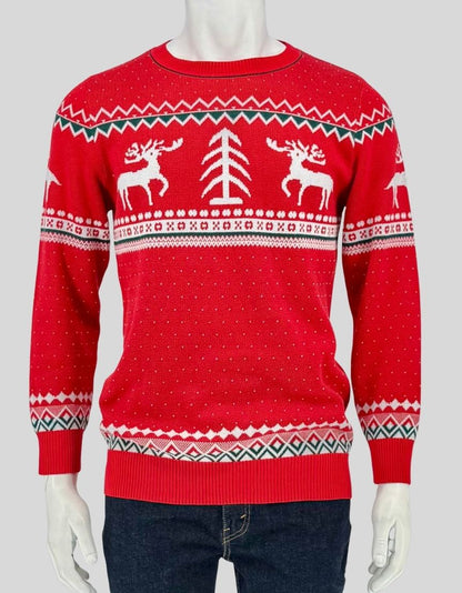 Authentic screen-worn Meaveor red Fair Isle Christmas sweater featuring reindeer, Christmas tree, and Nordic pattern design with white and green accents.