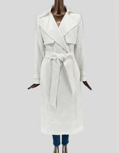 Authentic screen-worn Ever New cream belted trench coat featuring double-breasted front, epaulettes, self-tie belt, and traditional storm flaps.