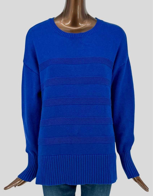 Authentic screen-worn Denver Hayes vibrant cobalt blue sweater featuring subtle tonal striped texture throughout the body. Featuring ribbed trim at the crew neckline, cuffs, and hem, with a relaxed, comfortable fit perfect for layering.