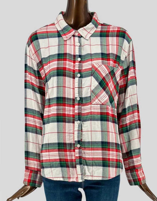 Authentic screen-worn AERIE festive plaid flannel shirt featuring red, green, navy, and cream holiday colors. Button-front design with chest pocket and soft brushed cotton fabric.