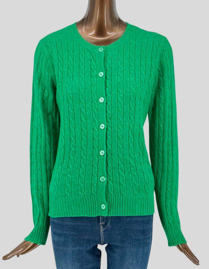 Authentic screen-worn Twik by Simons soft cable-knit crew-neck cardigan in vibrant green. Features recycled cotton blend fabric with classic cable-knit pattern, button-front closure, and ribbed cuffs and hem. 