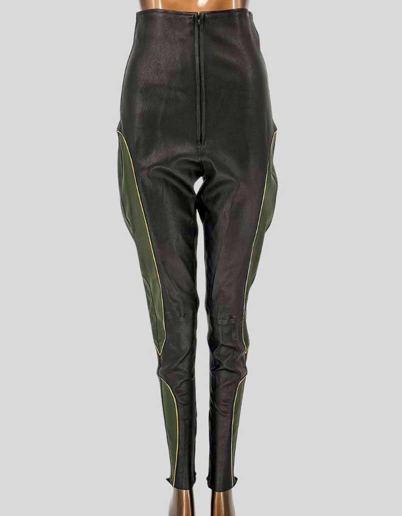 JONATHAN A. LOGAN custom-made black leather pants featuring green and yellow contrast piping along outer leg seams. High-waisted design with center front zipper closure. 