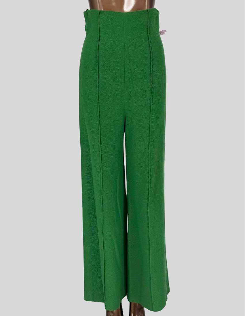 Authentic EMILIA WICKSTEAD emerald green high-waisted pants featuring textured crepe fabric, wide-leg silhouette with center front seaming detail, and concealed side zipper closure.