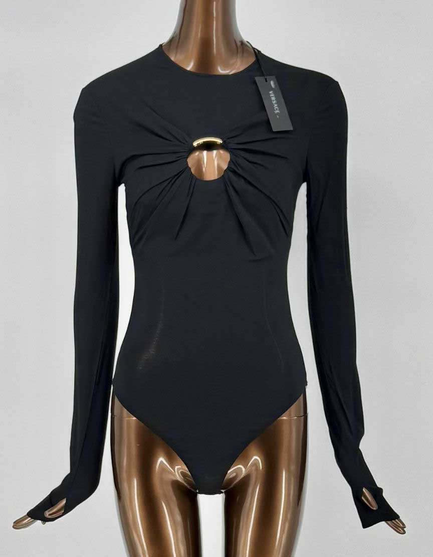 Authentic Versace long-sleeve bodysuit in black with signature gold Medusa hardware cutout detail. Features gathered fabric radiating from center gold-tone ring, creating dramatic draping effect. Thumb holes at cuffs for secure fit. Premium stretch viscose construction. 