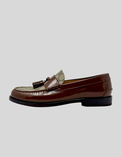 GUCCI GG Supreme Canvas and Leather Tassel Loafers in Beige/Brown. Iconic GG Supreme canvas upper with brown leather trim. Double leather tassel detail at vamp. Moc-toe stitching. 