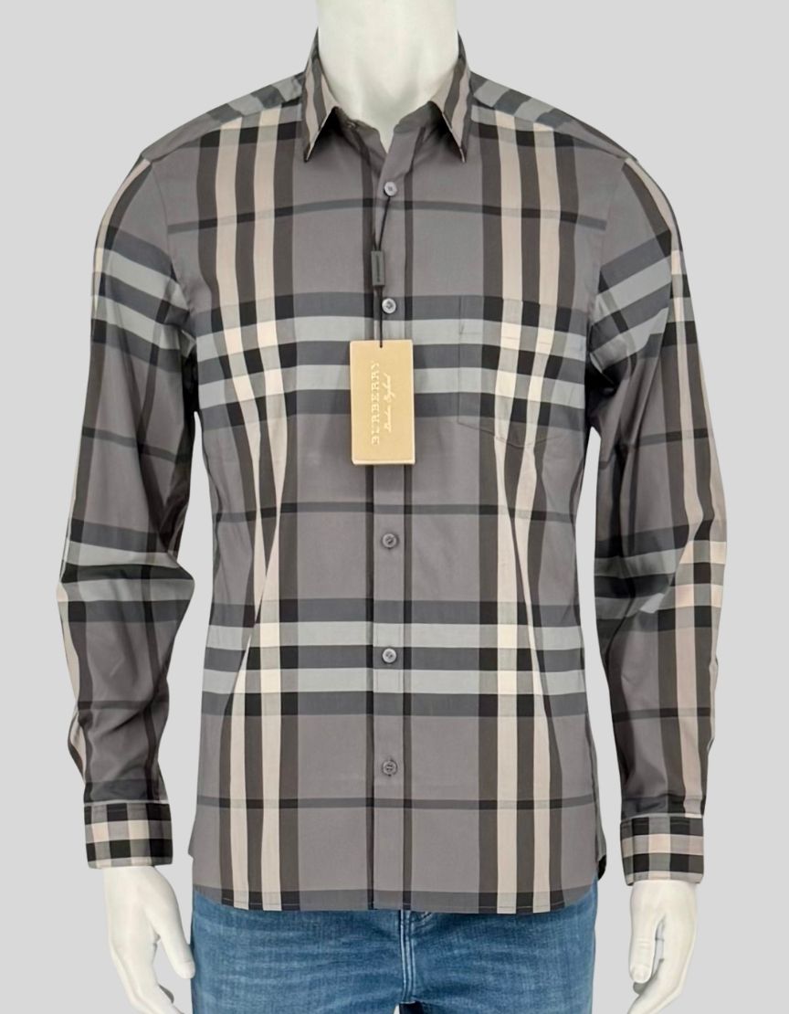 BURBERRY classic button-up shirt in signature grey/white/black check pattern. Features cotton construction with slight stretch for comfort, point collar, front button closure with mother-of-pearl buttons, long sleeves with single-button cuffs, chest patch pocket, and curved hem