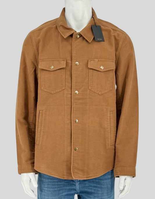  BILLY REID tobacco moleskin shirt jacket combining the lightness of a shirt with the structure of a jacket. Crafted from 100% cotton moleskin with an ultra-soft hand feel, featuring double chest pockets with flap snaps, double-welt waist pockets, 