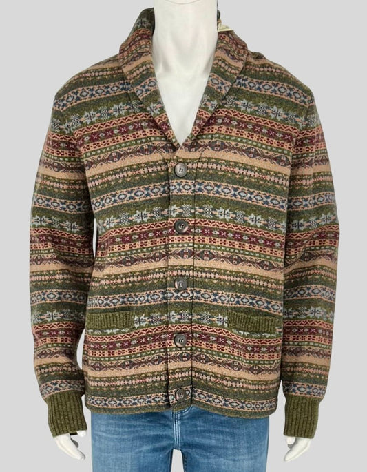 SCHOTT BROS traditional Fair Isle cardigan in classic earth tones featuring intricate geometric patterns in green, burgundy, tan, and navy. Shawl collar, button front closure, and ribbed cuffs and hem. 