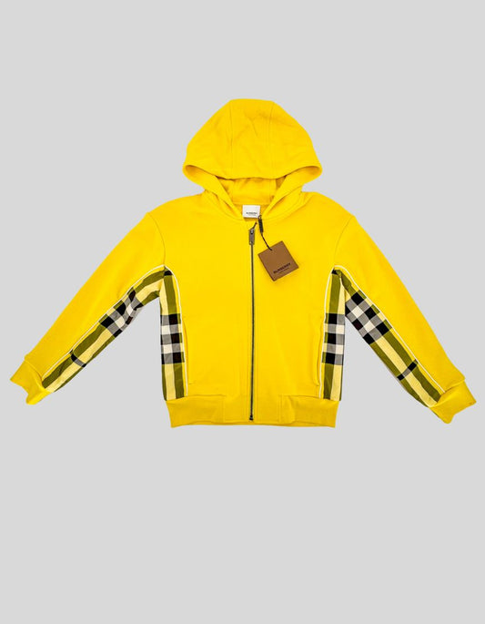 BURBERRY vibrant yellow zip-up hoodie featuring the house's iconic check panel detailing. Cotton-blend jersey with a soft brushed interior. Yellow, black, and white check panels run along the sleeves.