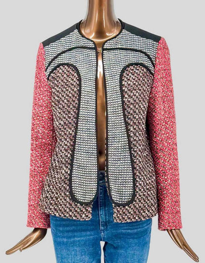 MISSONI mixed-media tweed blazer featuring colorblock design in coral pink, brown houndstooth, and cream/navy textured panels. Black trim outlines each section. Collarless design with concealed front closure. 