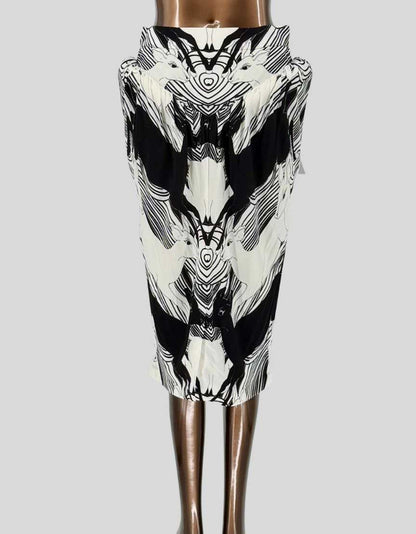 BURBERRY runway pencil skirt from the designer's collection featuring dramatic black and white swan print in mirror image design. Luxurious silk twill construction with signature Burberry tailoring. High-waisted silhouette with concealed back zipper and hook closure. Fully lined. 