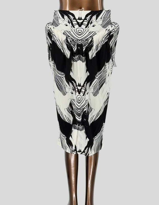 BURBERRY runway pencil skirt from the designer's collection featuring dramatic black and white swan print in mirror image design. Luxurious silk twill construction with signature Burberry tailoring. High-waisted silhouette with concealed back zipper and hook closure. Fully lined. 