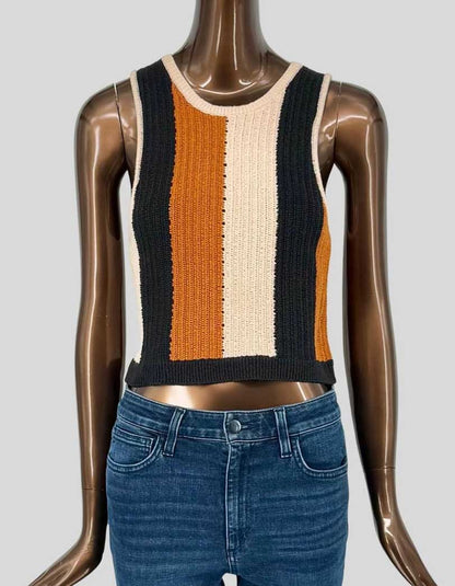 A.L.C. retro-inspired vertical stripe rib knit crop top in rust orange, cream, and black colorblock design. Features crew neckline, sleeveless silhouette, and contrast ribbed hem. Structured knit construction with fitted shape.